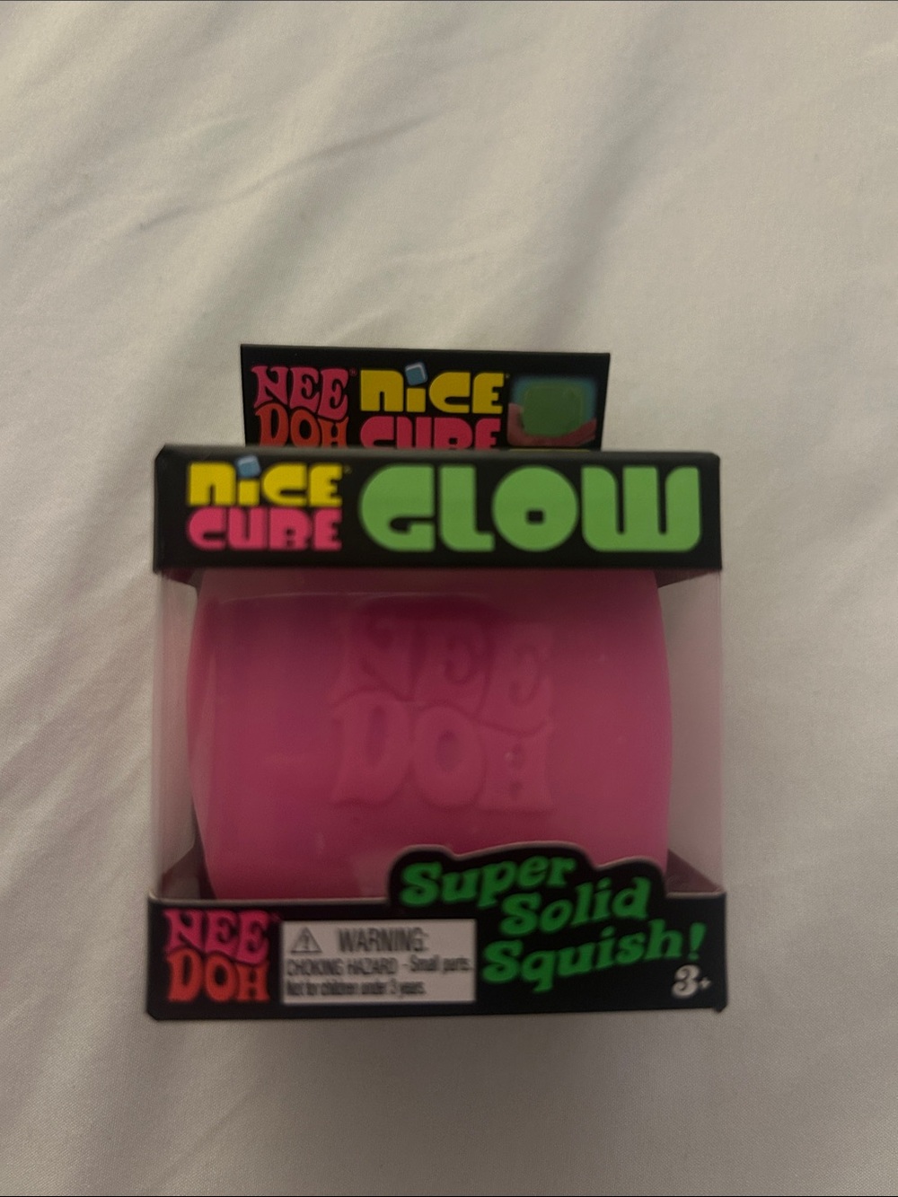 Nee Doh Glow Super Solid Squish! Pink Cube
